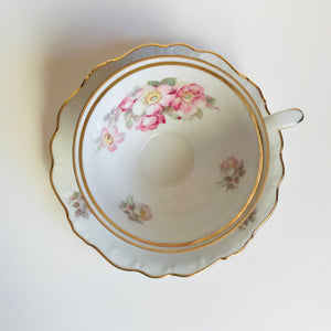 Vintage rosehip tea cup with saucer