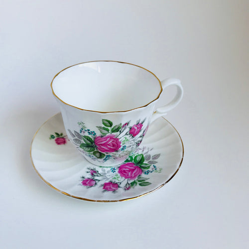 Vintage roses tea cup with saucer